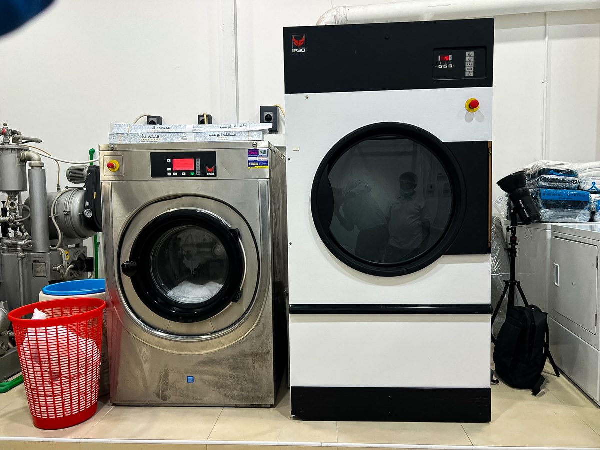 Industrial washing machines at Alwaab Laundry Express